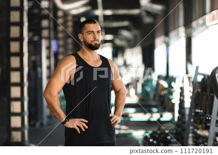 Workout Motivation. Young Muscular Male Holding Hands On Hips While Standing At Gym 111720191