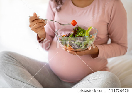 Cropped Shot Of Black Pregnant Lady Eacting Fresh Vegetable Salad At Home 111720676