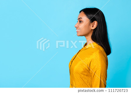 Side View Portrait Of Smiling Indian Young Lady Looking Aside 111720723