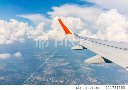 View from the airplane window during taking off on a clear summer morning 111721563