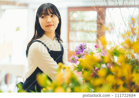 Female staff at a flower shop 111722684