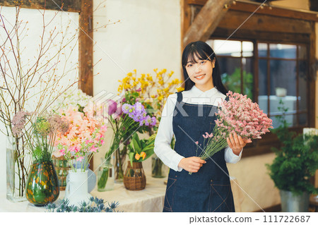 Female staff at a flower shop 111722687