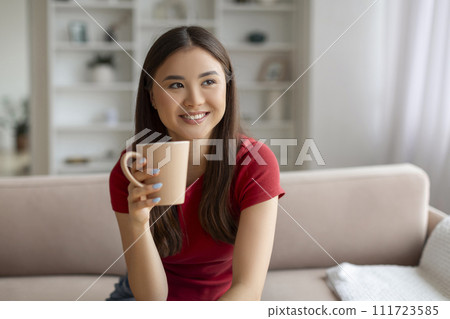 Domestic Leisure. Happy Smiling Asian Woman Drinking Coffee At Home 111723585