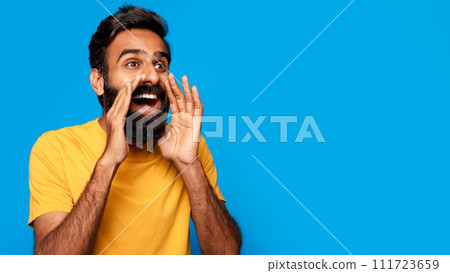 Middle aged indian man shouting message with hands around mouth 111723659