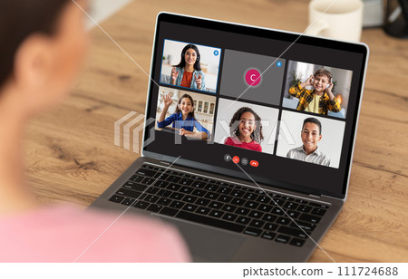 Over shoulder view of girl have online lesson, using laptop 111724688