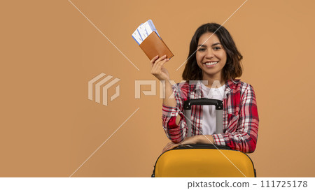 Excited young middle eastern woman going vacation 111725178