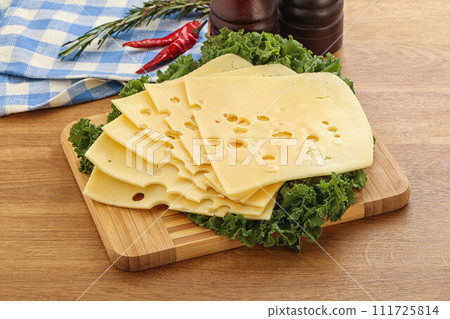Sliced maasdam cheese for breakfast 111725814