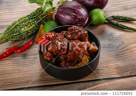 Asian cuisine - pork with chili sauce Asian cuisine - pork with chili sauce 111726091