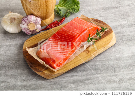 Raw salmon fillet over board Raw salmon fillet over board 111726139