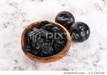 Dry prunes in thw bowl Dry prunes in thw bowl 111726140