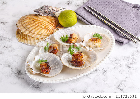 Grilled scallops shell with butter Grilled scallops shell with butter 111726531
