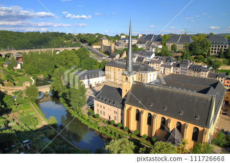 Saint-Jean Church in Grund seen from the top of a cliff in the capital of the Grand Duchy of Luxembourg, a world cultural heritage site in the Benelux 111726668