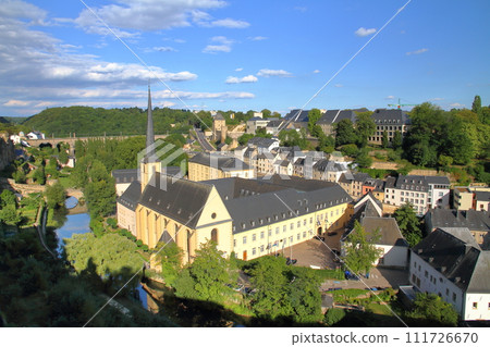 Saint-Jean Church in Grund seen from the top of a cliff in the capital of the Grand Duchy of Luxembourg, a world cultural heritage site in the Benelux Saint-Jean Church in Grund seen from the top of a cliff in the capital of the Grand Duchy of Luxembourg, a world cultural heritage site in the Benelux 111726670