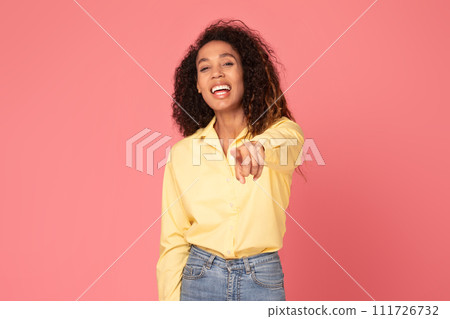 Happy black woman points at camera, choosing you on pink background 111726732