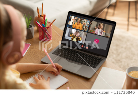 Homeschool girl student in headset learning during virtual online class Homeschool girl student in headset learning during virtual online class 111726840