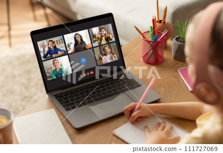Cute Little Schoolgirl Wearing Wireless Headphones Study With Laptop Cute Little Schoolgirl Wearing Wireless Headphones Study With Laptop 111727069