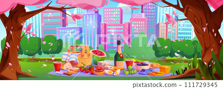 Picnic with basket and food on cloth in city park 111729345