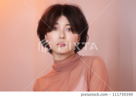 Portrait of a young woman photographed with colorful background Portrait of a young woman photographed with colorful background 111730399