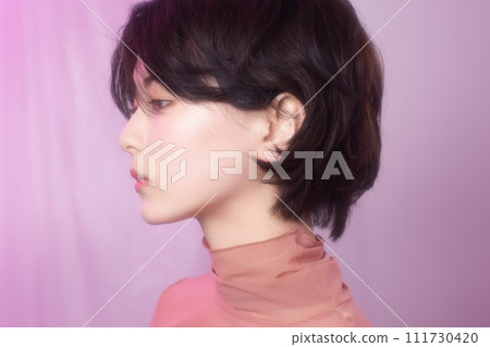 Portrait of a young woman photographed with colorful background 111730420