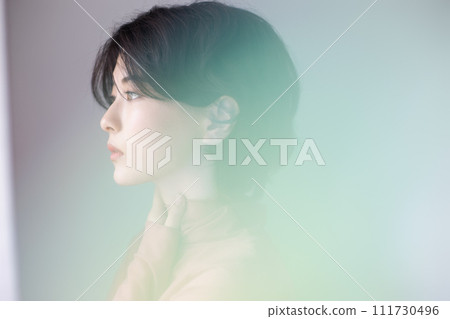 Portrait of a young woman photographed with colorful background Portrait of a young woman photographed with colorful background 111730496
