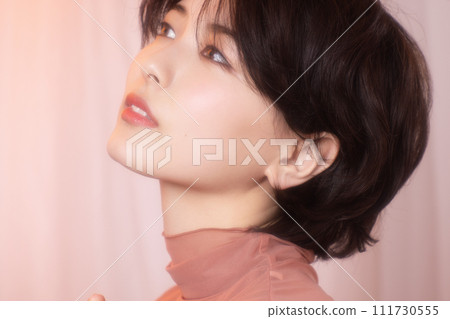 Portrait of a young woman photographed with colorful background 111730555