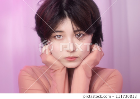 Portrait of a young woman photographed with colorful background 111730818