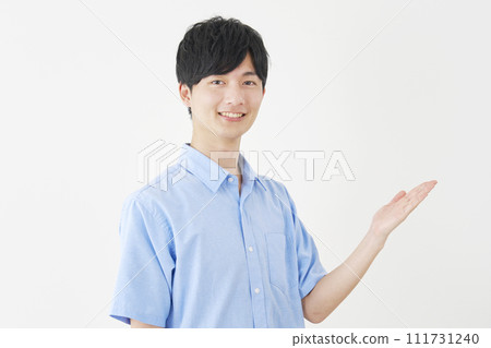 A man pointing to the right with his palm, white background A man pointing to the right with his palm, white background 111731240