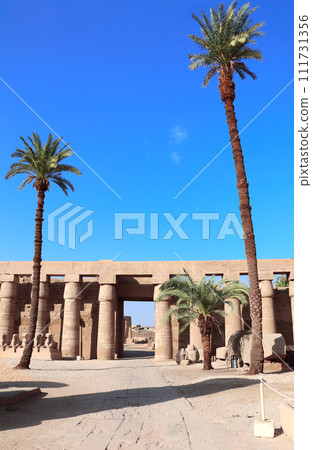Ancient column and ram-headed sphinxes in so-called Ethiopian court, Karnak temple complex, Luxor, Egypt, North Africa 111731356