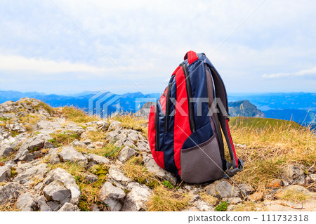 Tourist backpack on background of mountains in Swiss Alps. Travel outdoor concept 111732318