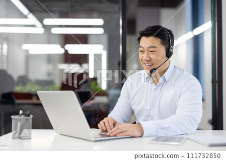 Man with headset phone close-up at workplace inside office, Asian in shirt customer service worker, businessman using laptop for video call, and customer consultation, telephone sales, Man with headset phone close-up at workplace inside office, Asian in shirt customer service worker, businessman using laptop for video call, and customer consultation, telephone sales, 111732850