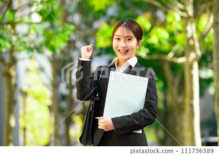 Young female business newcomer fist pump Young female business newcomer fist pump 111736389