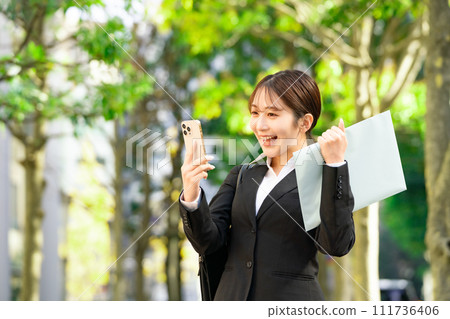 Young female business newcomer fist pump Young female business newcomer fist pump 111736406