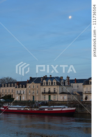 Angers, France. Morning moon and view along the River Maine. Photographed on December 29, 2023. Angers, France. Morning moon and view along the River Maine. Photographed on December 29, 2023. 111736504