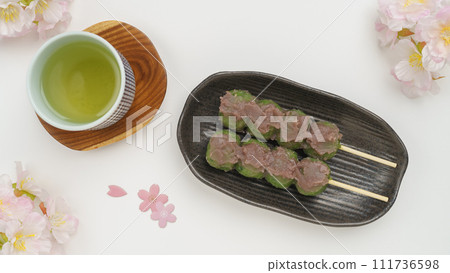 Grass dumplings, green tea and cherry blossoms Grass dumplings, green tea and cherry blossoms 111736598