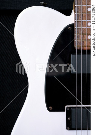 Electric guitar on the background of the guitar amplifier. 111738064