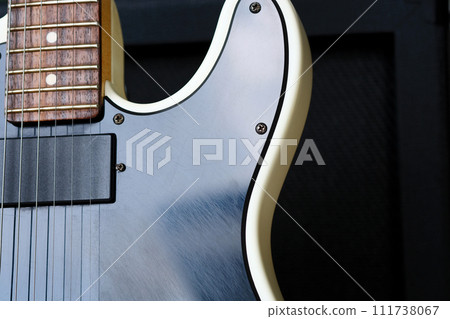 Electric guitar on the background of the guitar amplifier. 111738067
