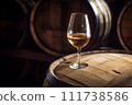 Wine Glass with Chardonnay Grapevine tasting. Vino Degustation in wine cellar with Wine barrels. 111738586