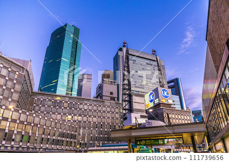 Japan's Tokyo cityscape February - View of Shiodome's office buildings from in front of Shinbashi Station (Shiodome underground ticket gate entrance) (night view) Japan's Tokyo cityscape February - View of Shiodome's office buildings from in front of Shinbashi Station (Shiodome underground ticket gate entrance) (night view) 111739656
