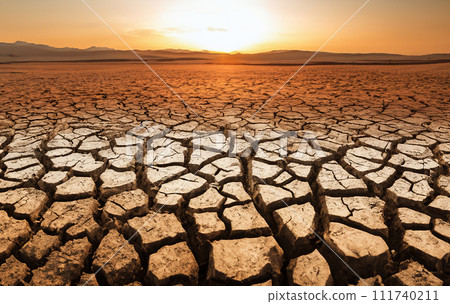 Drought land, Dries, Global drought. Dry cracked earth on sunset. 111740211