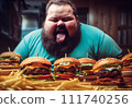 Fat man eating hamburger in fast food restaurant.  111740256