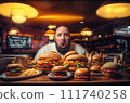 Fat man eating hamburger in fast food restaurant.  111740258