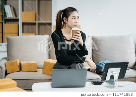 Young asian Woman Thinking and Working on sell online in cozy house, Modern Lifestyle of New Generation People. 111741898