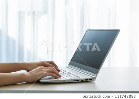 Hand using laptop and type on the keyboard. Mockup screen of advertisement. Hand using laptop and type on the keyboard. Mockup screen of advertisement. 111742888