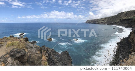 Panoramic coastal landscape rocky cliff, sea waves and blue sky with clouds Panoramic coastal landscape rocky cliff, sea waves and blue sky with clouds 111743004