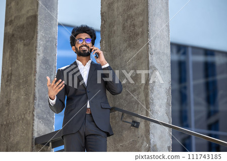 Young businessman having a phone call and looking involved 111743185