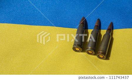 Several bullets are on the Ukrainian flag. Several bullets are on the Ukrainian flag. 111743437