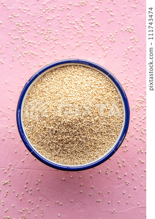 Quinoa in a bowl, healthy organic wood, uncooked Quinoa in a bowl, healthy organic wood, uncooked 111743474