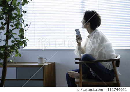 Middle woman using a smartphone 111744051