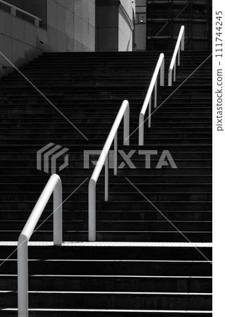 Stairs and white railing, black and white Stairs and white railing, black and white 111744245
