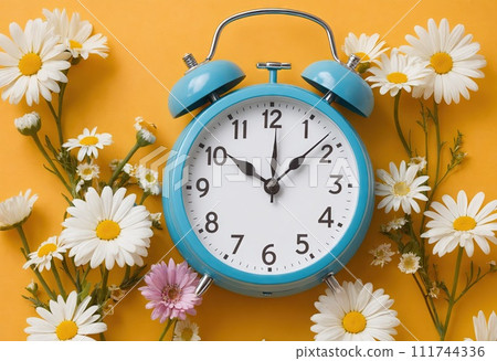 Creative idea layout alarm clock on yellow background with chamomile. Business and dst concept. Summer time and daylight. Ai generation 111744336